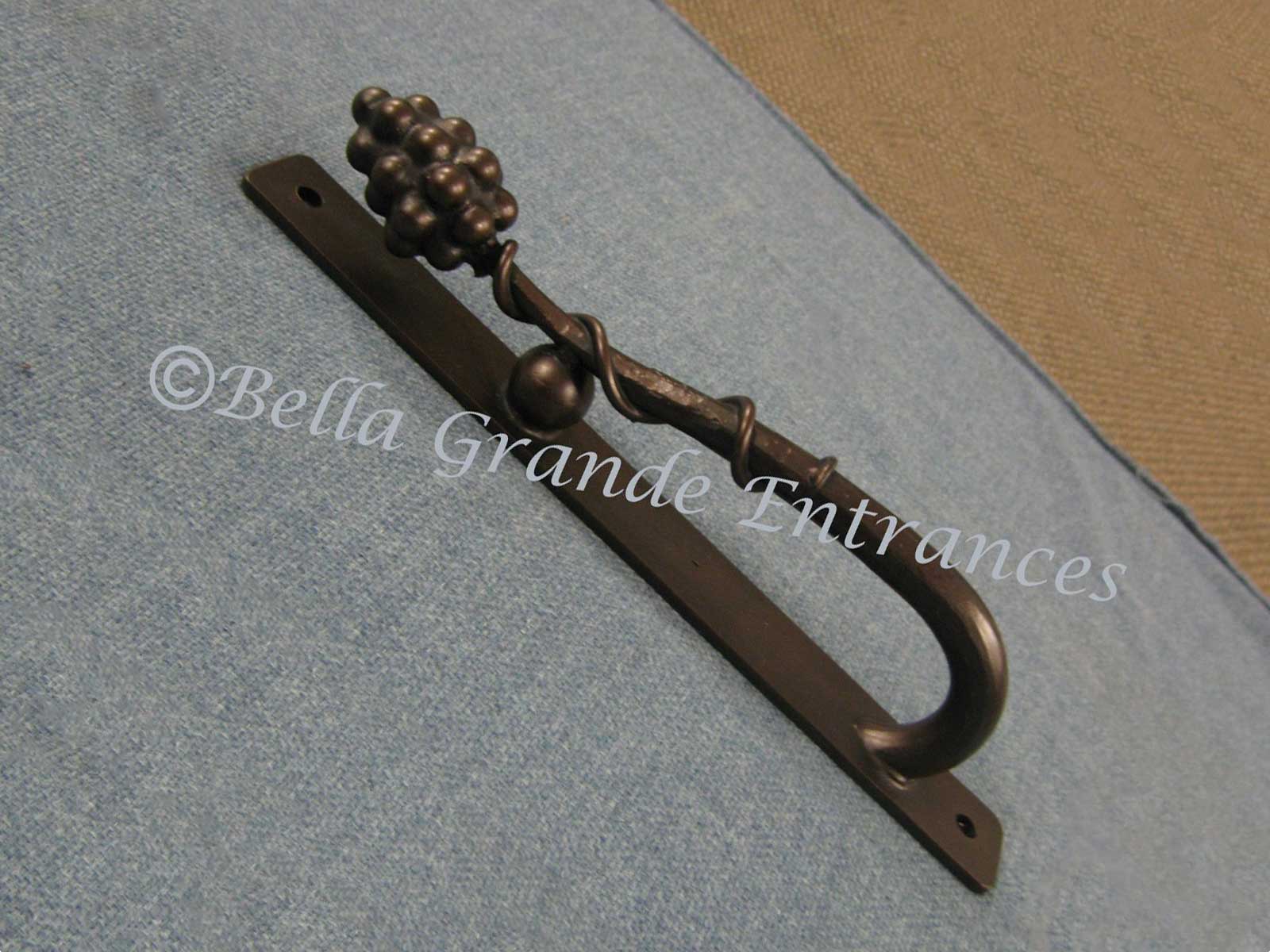 A Grape Vine Tube Pull handle 45 degree rotate image on a grey cloth surface