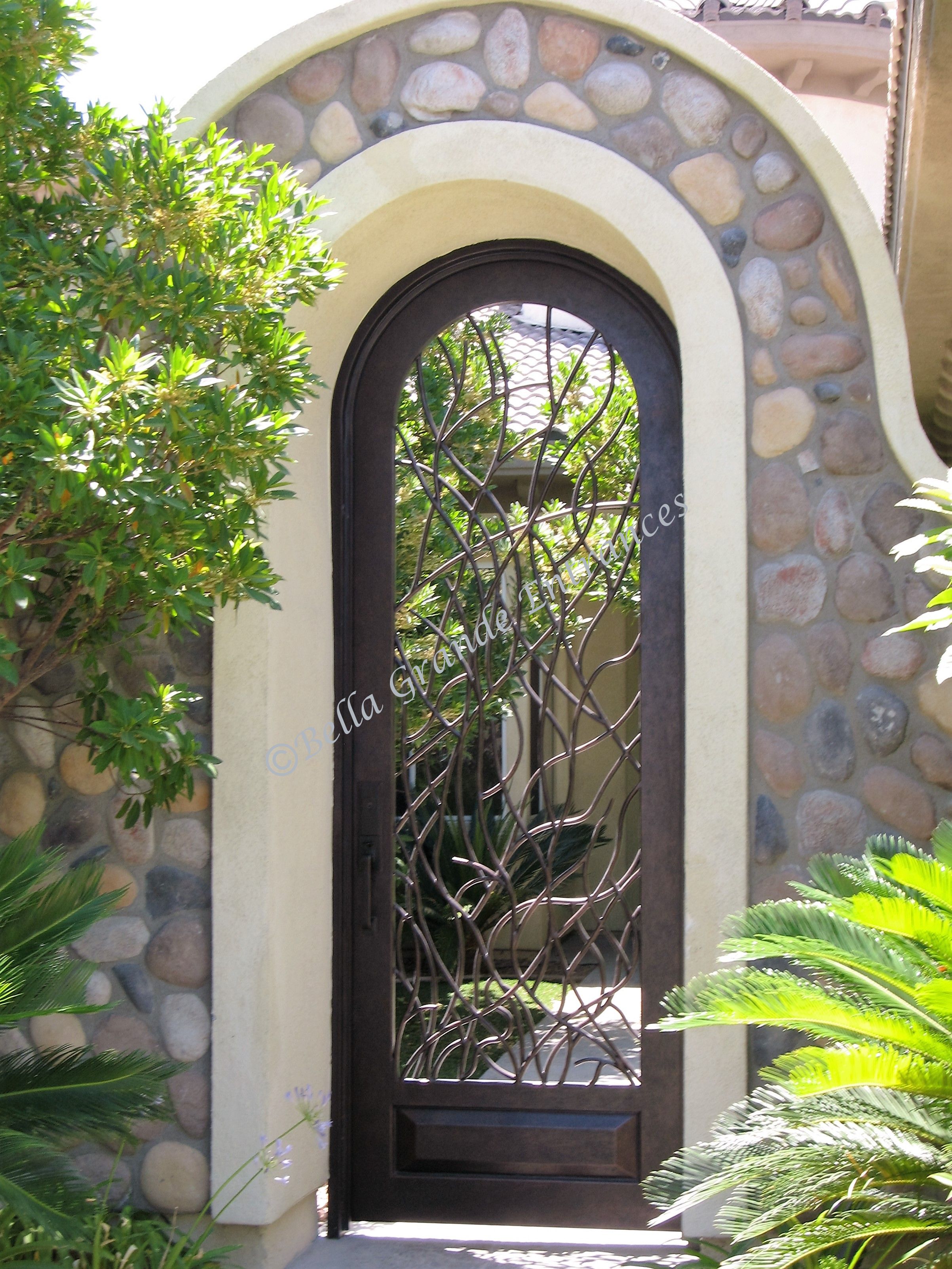 Beautiful house entrance in Las Vegas with a decorative wrought iron gate.