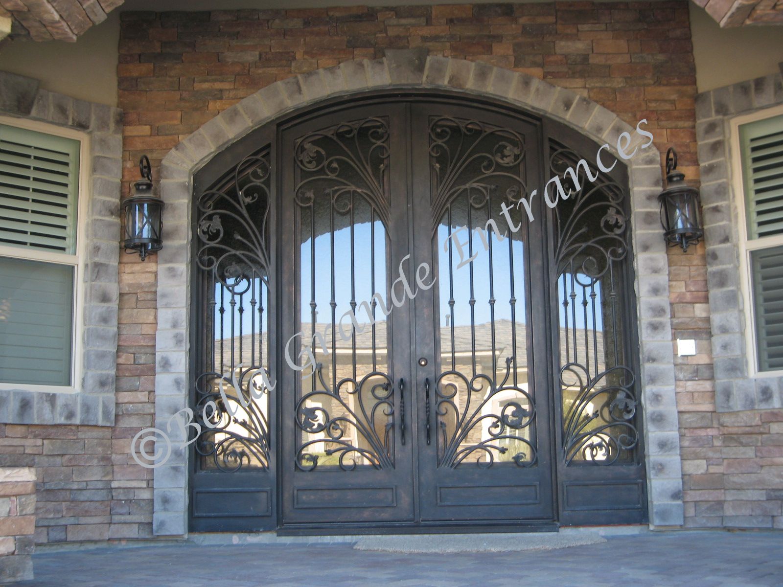 Captivating shot of double iron door with intricate grills. Bella Grande Entrances crafted elegant entrance for house in Las Vegas.