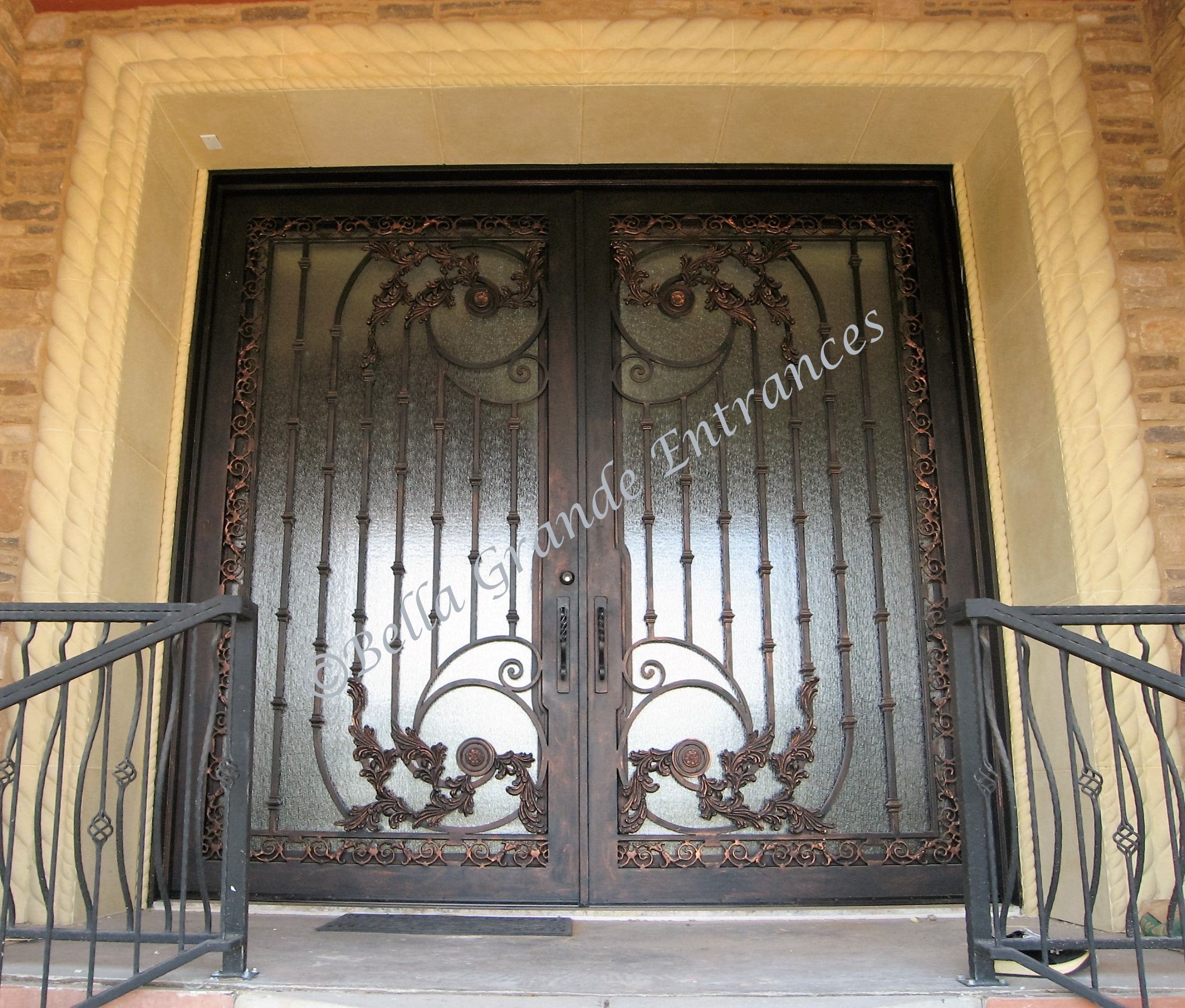 Close-up of a grand and ornate double iron door at a luxurious house in Las Vegas, skillfully made by Bella Grande Entrances.