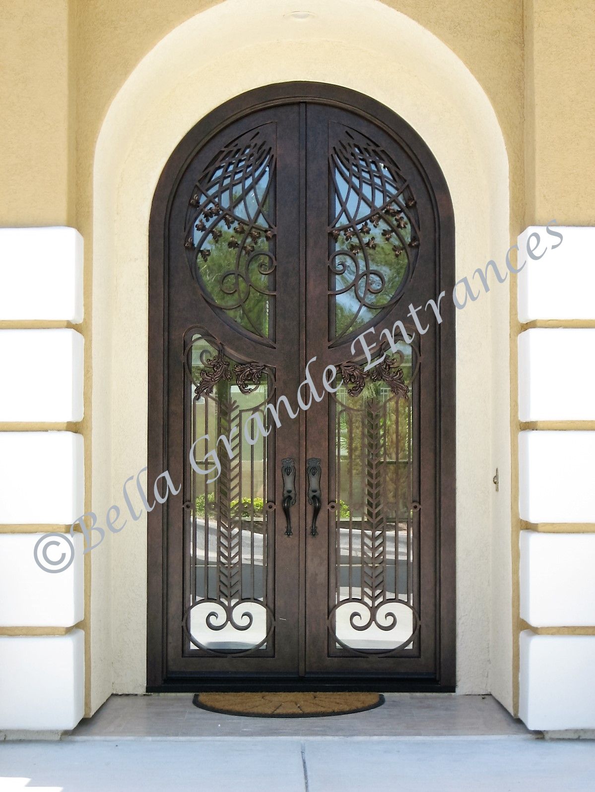 This beautifully crafted Decorative Double Iron Door, manufactured by Bella Grande Entrances Las Vegas, is elegantly showcased at the entrance of a house.
