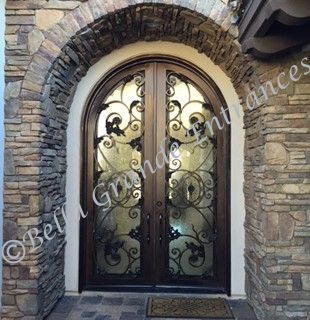 Photo of an ornamental double iron door crafted by Bella Grande Entrances installed at a house entrance in Las Vegas.