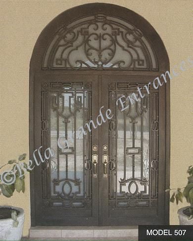 Close-up photo of an elegant double iron door with a window grill at the entrance of a house in Las Vegas. This design was creatively crafted by Bella Grande Entrances.